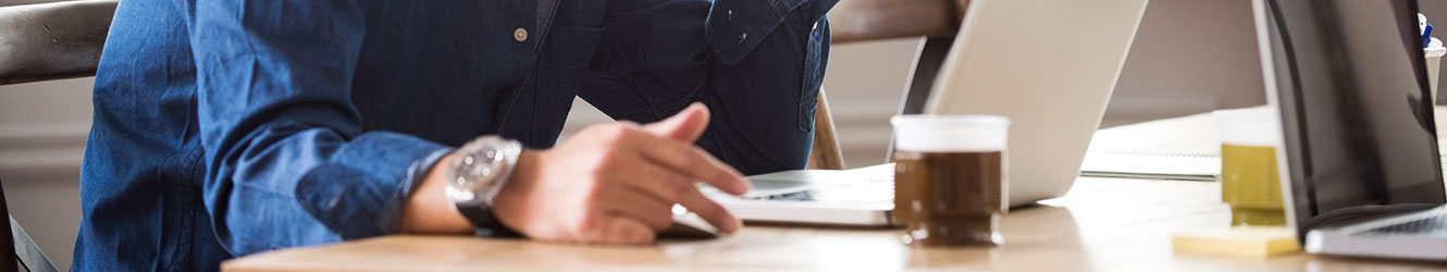 Man at desk with laptop.